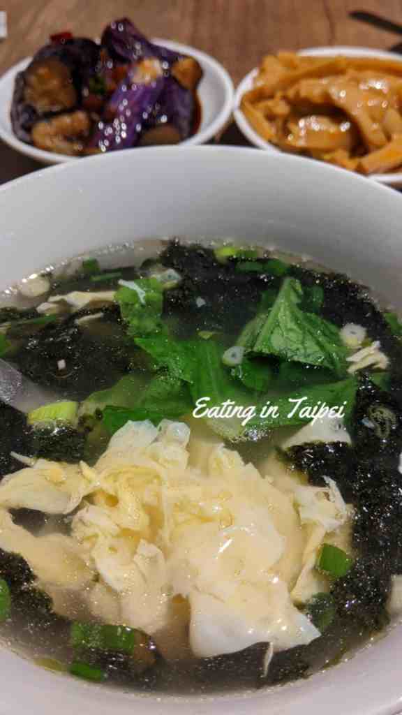 The soup is a standard seaweed soup with a cracked egg inside.